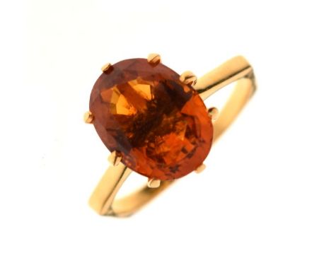 Dress ring set orange coloured stone, the shank stamped 18ct, size Q, 3.3g gross approx  