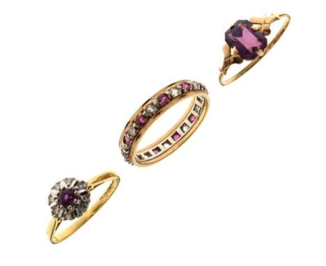 18ct gold, ruby and diamond set dress ring, a diamond set eternity ring and a dress ring set amethyst coloured stone stamped 