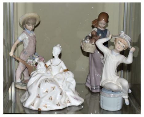 Four various porcelain figurines comprising: Lladro - girl with puppies, child with flower-filled wheelbarrow, and seated chi