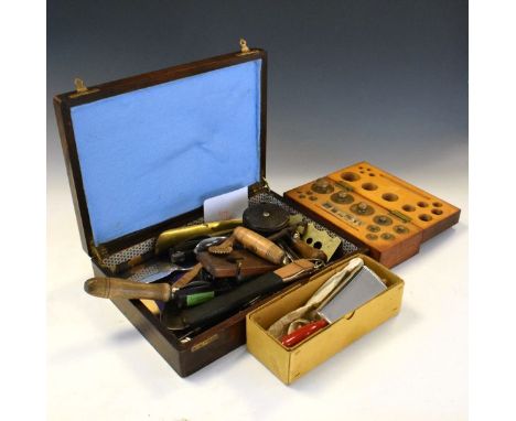 Wooden box containing an assortment of weights, tools, wooden pastry-jiggers, button-polisher, dividers, spring balance, etc 