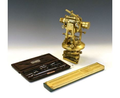 20th Century surveyor's brass level with sighting barrel over compass having black dial on revolving stage, together with sun