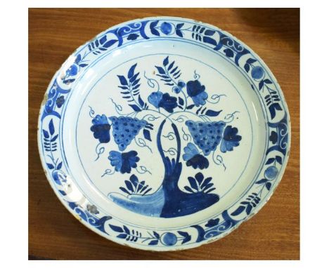 18th/early 19th Century Delftware dish, decorated with fruiting vines within a flower border, unmarked, 25.5cm diameter  