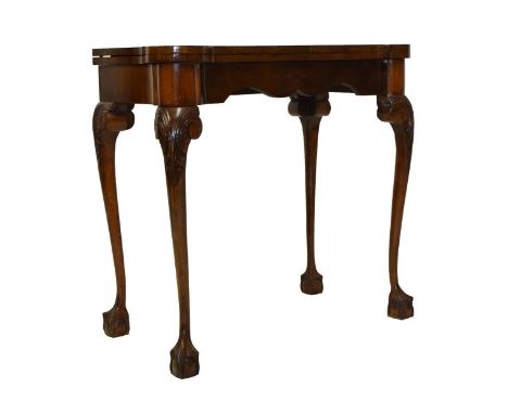 Early 20th Century figured walnut crossbanded Queen Anne style card table, the hinged top revealing a baize interior, raised 