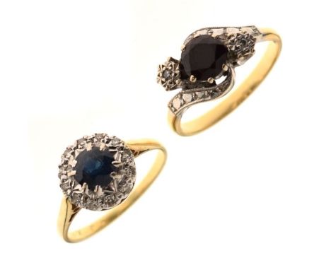 Crossover design dress ring set diamonds and garnet coloured stone, the shank stamped 18ct, and a sapphire and white stone dr