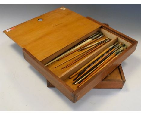 Two vintage artist's travelling art cases with sliding front as palette enclosing paint brush divisions, 40.5cm wide (2)  