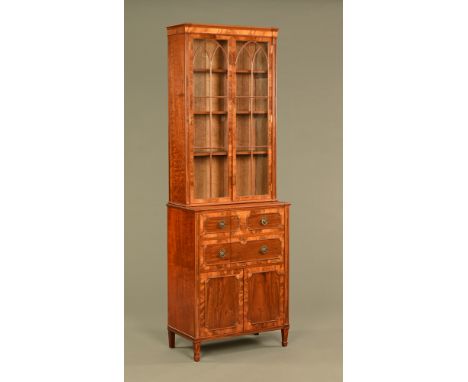 George III style bookcase, in two sections, the upper part with wooden astragals opening to shelves, the base fitted with dra
