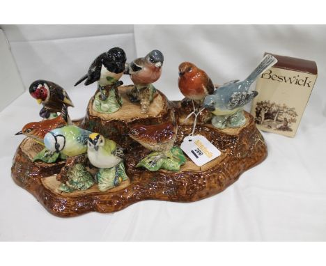 Beswick bird ornaments on stand