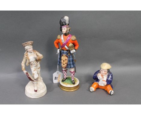 Three figurines, one inscribed 92nd foot, seated figure drinking and musician playing tambourine