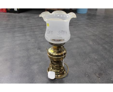 Electric lamp in form of an oil lamp