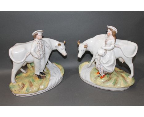 Two 19th century Staffordshire figures of man with cow and woman with cow