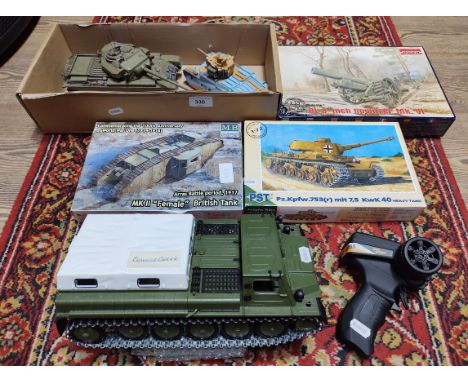 A small rc crawler carrier, three military unbuilt model kits &amp; 2 built tanks.  