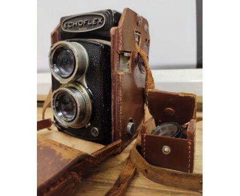 An Echoflex twin lens camera, model no.5464, in leather case.  