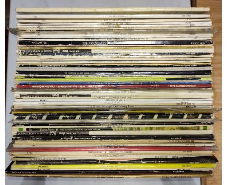 A box of vinyl LP records including ten Bob Dylan albums, Pink Floyd 'The Wall', Pete Seager, etc.  