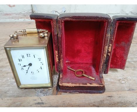 A French brass carriage clock in leather case.  
