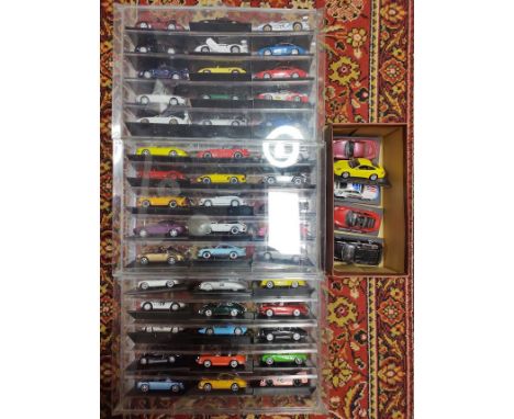 Three display cases of assorted model sports cars & some loose.Note:- This lot includes all the model sports cars & the 3 cas