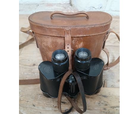 A pair of WWII Zeiss Jena Delactis 8 x 40 binoculars with retailed by Negretti &amp; Zambra with leather case.  