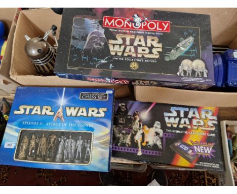 Three Star Wars games; Attack of the Clones chess set, Interactive Video Board Game and Collector's Edition Monopoly.  