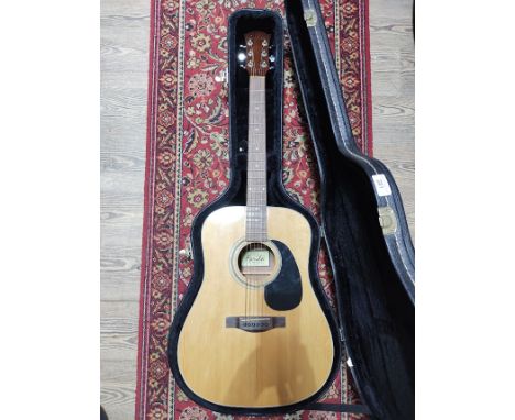 A Farida acoustic guitar, model D-8N, in hard case.  
