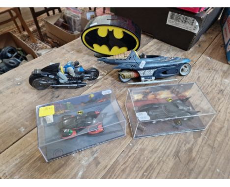 Batman toys and collectables including model vehicles (two in boxes) and money bank.  