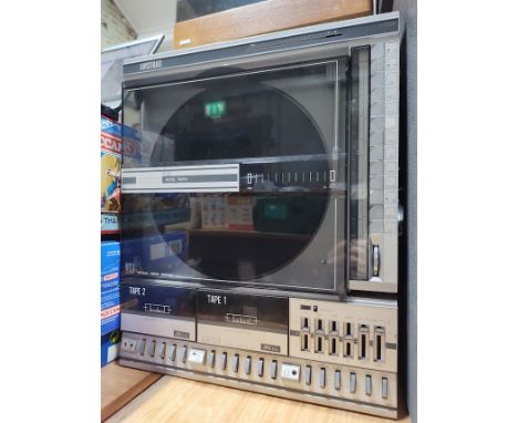 An Amstrad model SM104 Vertical Linear Tracking turntable with twin tape deck and radio.  