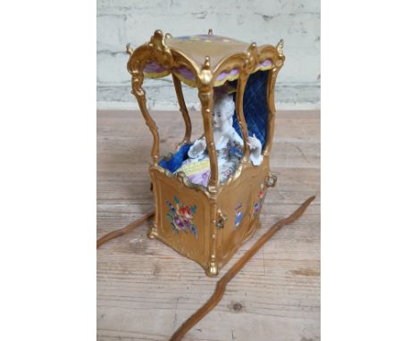 A porcelain model sedan chair by Carl Thieme Potschappel porcelain, Dresden, circa 1900, modelled as an 18th century continen