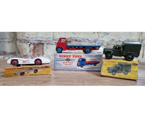Three Dinky toys comprising of a duy flat truck 512, mercedes benz racing car 237 &amp; an army 1-ton cargo truck 641, all wi