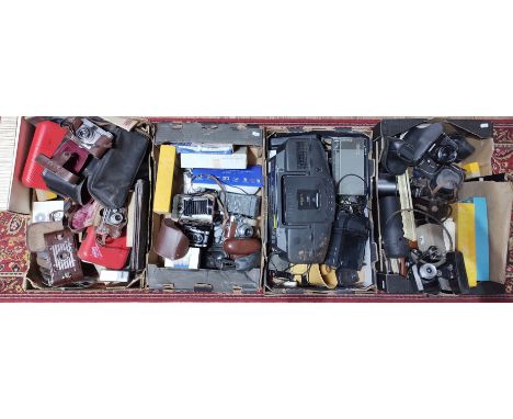 Four boxes of vintage cameras, accessories, radios, etc.  