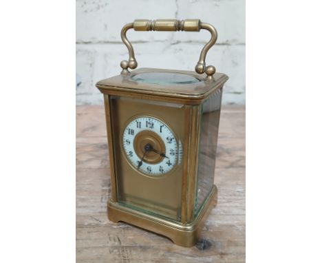 A French masked dial brass carriage clock.  
