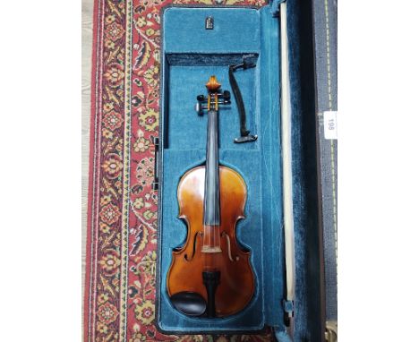 A Stradivarius copy violin by Jean Baptiste Martinelli, two piece back, 360mm, with bow and case.  