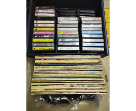 A box of vinyl LP records, cassettes and 45s including Bob Dylan, Kate Bush, The Who, The Rolling Stones, David Bowie, The Ki