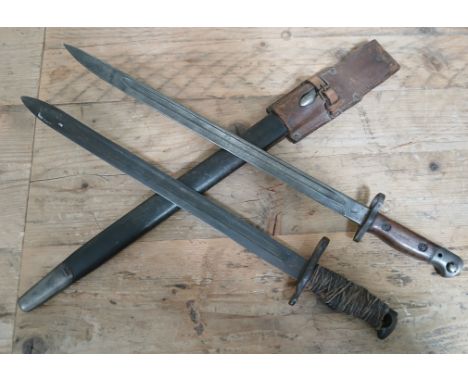 A British WWI 1907 pattern bayonet and scabbard, the blade marked '1907 Wilkinson' and with proof marks, together with an  Am