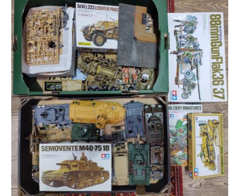 Two boxes of assorted military model kits, some built, some unbuilt in boxes.  