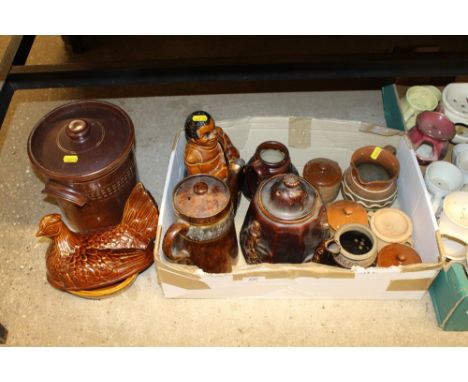 A box containing treacle glazed teapot, and various stoneware jars
