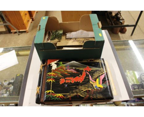 A box containing lacquered photo album; other albums; various post-cards and photographs 
