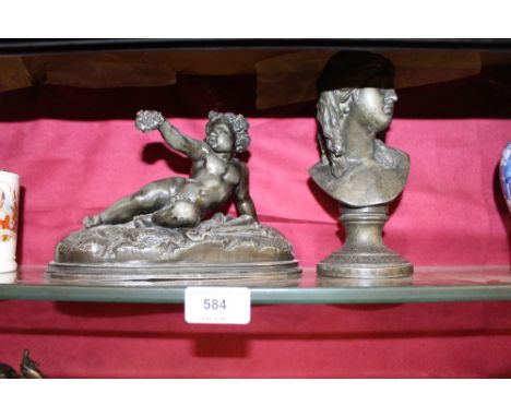 A Spelter bust; and a spelter model of a reclining figure 