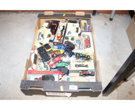 A box of die-cast model vehicles, some boxed