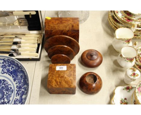 A collection of burr wood items to include trinket boxes, letter rack etc. 