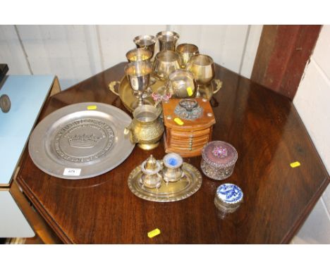 A collection of metalware to include silver plated goblets, pewter plate, cruet items, place mats, trinket boxes etc. 