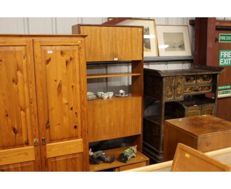 A G-plan shelf unit having drop front cabinet above sliding doors 