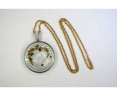 A circular locket pendant&nbsp;decorated with guilloche enamel in pale grey with painted garland of flowers and ladybird, 3.5