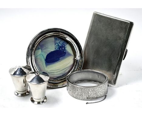 A heavy quality silver cigarette case, Frederick Field Ltd, Birmingham 1940, to/w an Art Deco salt &amp; pepper pair of taper