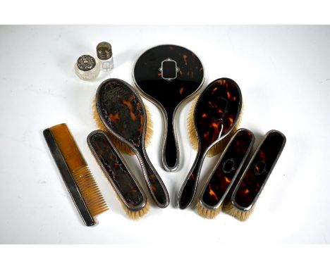A matched silver and piqué-work tortoiseshell four-piece brush/mirror set, Birmingham 1923/26 (little used), to/w two similar