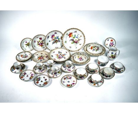 A quantity of Dresden floral-painted porcelain tableware, including two covered dishes, five each coffee cups and tea cups, m