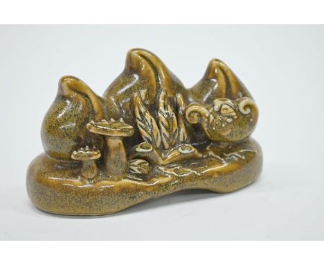 A Chinese three-peach ceramic scholars brush rest covered in an opaque mottled tea dust (chayemo) glaze, 6.5 cm h x 16 cm wGo