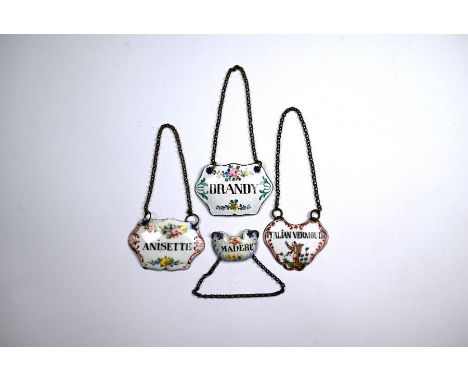 Four antique continental enamel decanter labels