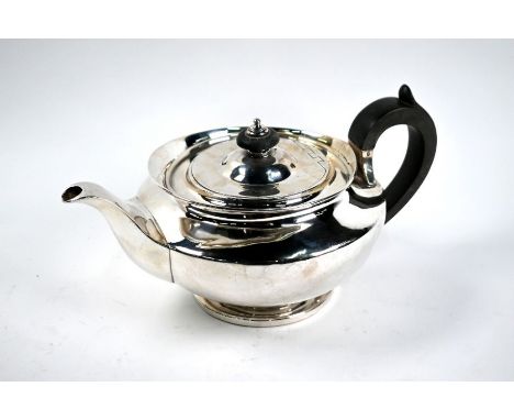 A George IV silver teapot in the Empire manner, on stemmed circular foot, Eley &amp; Fearn, London 1823, 21.8 (678g) grossGoo