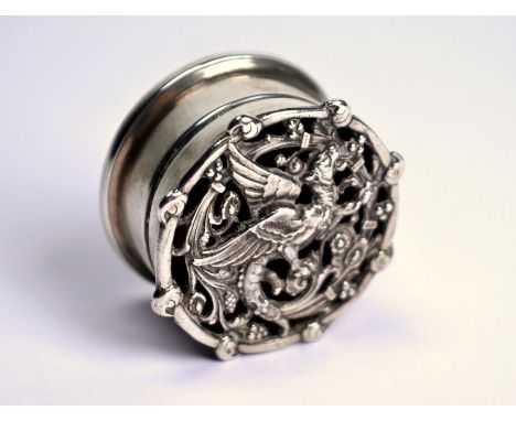 A small cylindrical silver pomander, the pierced cover cast with a gryphon, London 1910, 3.5cm diameter (makers' marks obscur