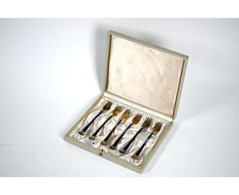 A cased set of six Danish enamelled silver gilt forks with pierced crown finials, Egon Lauridsen, Copenhagen, 12.5cm (three w