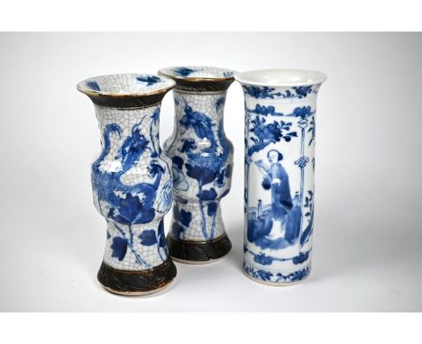 A pair of Chinese blue and white gu-form vases, late 19th or early 20th century, each painted in underglaze blue with dragons