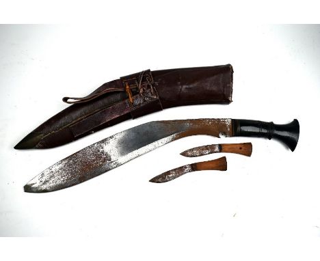 A vintage Nepalese kukri with 35 cm blade (tip broken off) and horn handle, in brown leather military scabbard to/w four Bena